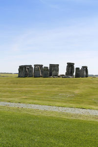 Built structure on field against sky