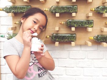 Portrait of girl having ice cream in restaurant