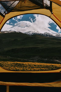 Scenic view of snowcapped mountains against sky