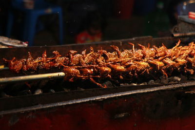 Close-up of meat on barbecue grill