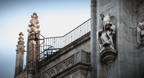 Low angle view of statue against building