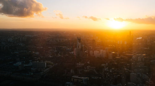 Cityscape against sky during sunset