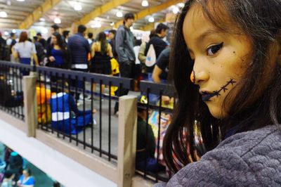 Close-up of cute girl with face paint during halloween