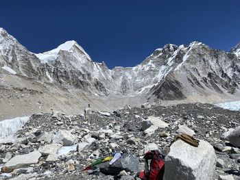 Scenic view of snowcapped mountains against clear blue sky