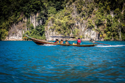 People in boat on sea