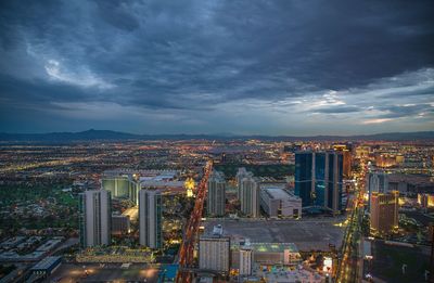 High angle view of cityscape against cloudy sky