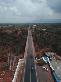 High angle view of vehicles on road against sky