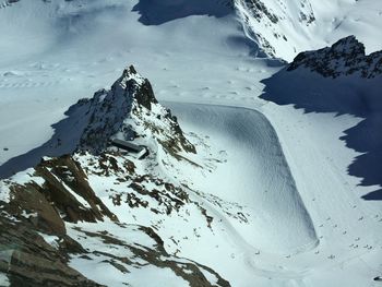 High angle view of snow covered land and mountains