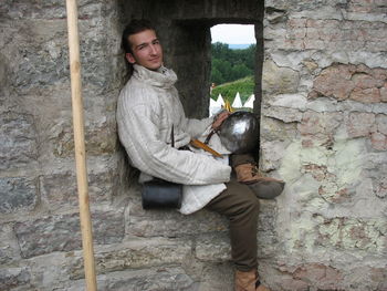 Portrait of mature man sitting outdoors