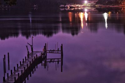 Scenic view of lake against sky at night