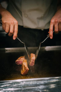 Close-up of man preparing food