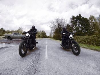 Man riding motorcycle on road