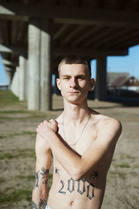 Portrait of young man standing outdoors