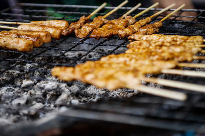 Close-up of meat on barbecue grill