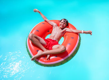 High angle view of man swimming in sea