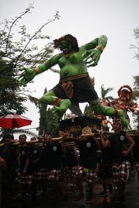 Low angle view of statues against sky