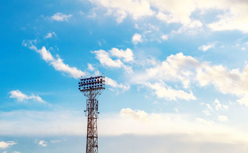 Stadium spotlight set on background of blue sky. blue sky with white clouds.