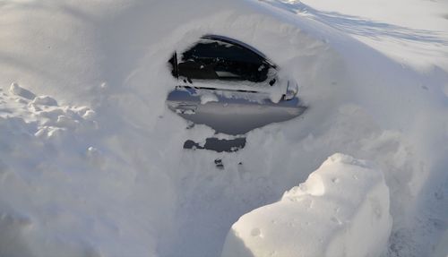 High angle view of snow covered car