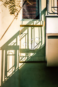 Shadow of window on wall of building