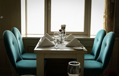 Table and chairs on sofa at home