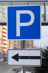 Road sign against blue sky