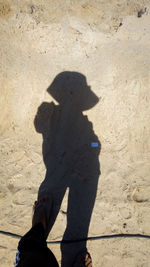 Shadow of person on sand