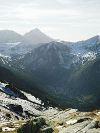 Scenic view of snowcapped mountains against sky