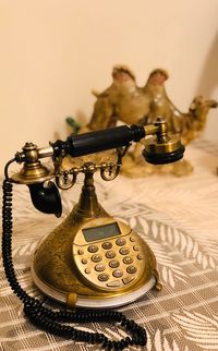 Close-up of telephone on table