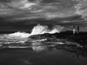 Scenic view of sea against cloudy sky