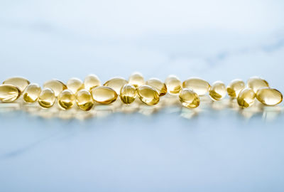 Close-up of pearl jewelry over white background