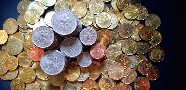 High angle view of coins on table