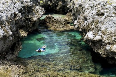 High angle view of man swimming in sea