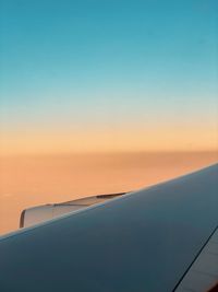 Scenic view of sea against clear sky during sunset