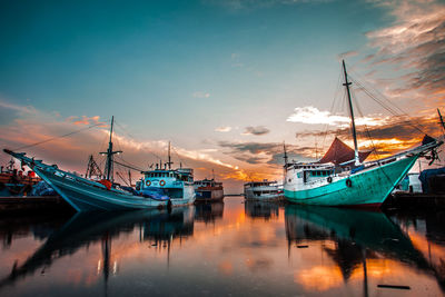 Boats moored at harbor