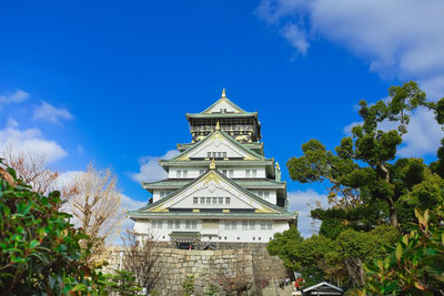 Low angle view of building against blue sky