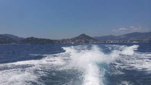 Scenic view of sea against clear blue sky
