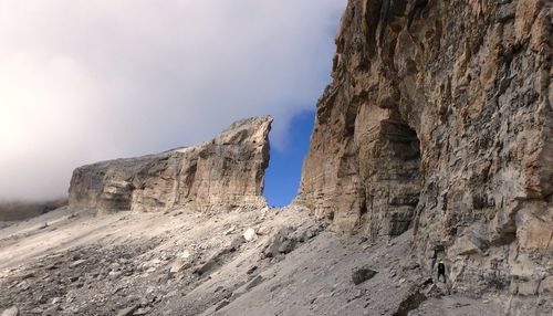 Rock formations on mountain against sky