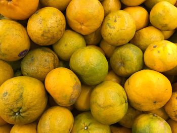 Full frame shot of oranges for sale at market