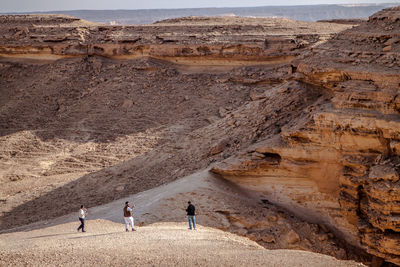 High angle view of people on mountain at tuwaiq