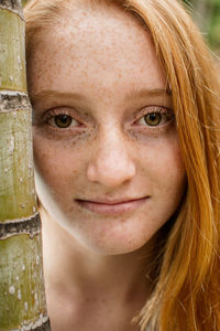 Close-up portrait of a smiling young woman