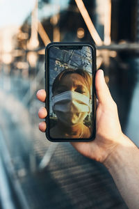 Man photographing with mobile phone