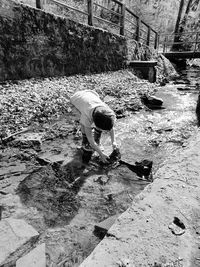 High angle view of man standing by water