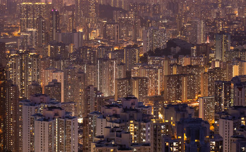 Aerial view of illuminated buildings in city at night
