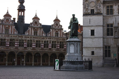 Statue in front of building