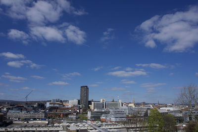 High angle view of sheffield city centre buildings against blue sky