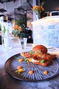 Close-up of croissant in plate on table