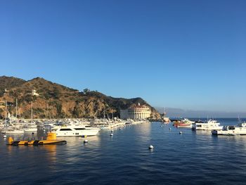 Boats moored in bay