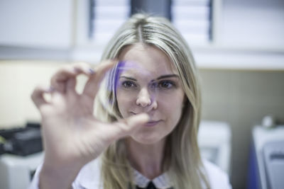 Optometrist looking through eydeglass lens