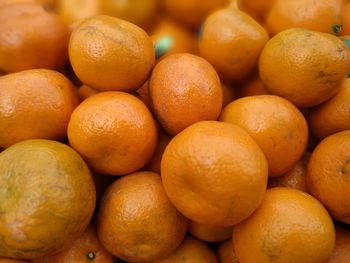 Full frame shot of oranges at market stall