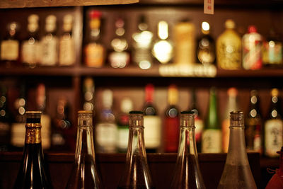 Close-up of wine bottles at bar